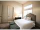 Comfortable bedroom featuring a bright window, a cozy bed, and stylish furnishings at 9 Knob Oak Dr, Henderson, NV 89052