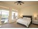 Spacious bedroom features large windows, a comfortable bed, and an exit to an outdoor pool area at 9 Knob Oak Dr, Henderson, NV 89052
