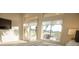 Bright, modern bedroom with backyard views through sliding glass doors and large windows, letting in ample natural light at 9 Knob Oak Dr, Henderson, NV 89052