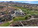 Stunning aerial view of the golf course with well manicured greenways and landscaping at 9 Knob Oak Dr, Henderson, NV 89052