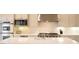 Bright, well-appointed kitchen with marble countertops and stainless steel appliances at 9 Knob Oak Dr, Henderson, NV 89052
