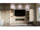 Stylish living room with stone accent wall and modern fireplace at 9 Knob Oak Dr, Henderson, NV 89052