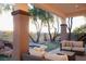 Serene covered patio with comfortable seating, mini-golf, spa and a beautiful water feature for relaxation at 9 Knob Oak Dr, Henderson, NV 89052
