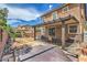 The property has a covered patio, desert landscaping, hot tub, and sliding glass door access to the home at 9005 Semillon St, Las Vegas, NV 89148