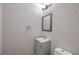 Small half-bath features a single vanity with modern fixtures and a gray cabinet at 9005 Semillon St, Las Vegas, NV 89148