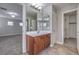 Bathroom with a vanity, dual mirrors, and access to bedroom and a walk-in closet at 9005 Semillon St, Las Vegas, NV 89148