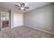 Bedroom featuring neutral walls and carpet, a ceiling fan, and closet with sliding doors at 9005 Semillon St, Las Vegas, NV 89148