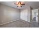 Bedroom featuring a ceiling fan, closet with sliding doors, and access to the hallway at 9005 Semillon St, Las Vegas, NV 89148