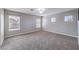 Bright and spacious bedroom with neutral carpeting and multiple windows at 9005 Semillon St, Las Vegas, NV 89148