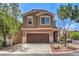 Charming two-story home featuring a well-maintained front yard, and a convenient two-car garage at 9005 Semillon St, Las Vegas, NV 89148