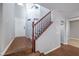 Bright foyer with staircase, hardwood floors, and a view of the front door at 9005 Semillon St, Las Vegas, NV 89148