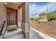 Inviting front porch features a secure door and a charming welcome mat for a warm entry at 9005 Semillon St, Las Vegas, NV 89148