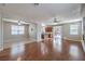 Spacious living room with hardwood floors that connects to kitchen area with ample space at 9005 Semillon St, Las Vegas, NV 89148