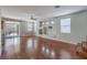 Open-concept living room with wood floors, a cozy fireplace, and easy access to the backyard at 9005 Semillon St, Las Vegas, NV 89148