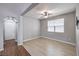 Inviting room with wood floors, ample natural light, and ceiling fan creating a comfortable area at 9005 Semillon St, Las Vegas, NV 89148