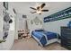 Fun bedroom with a window, blinds, bed, and sports-themed decorations at 9105 White Eyes Ave, Las Vegas, NV 89143