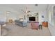 Bright, neutral living room featuring modern ceiling fan, vaulted ceilings, and an open floor plan at 9105 White Eyes Ave, Las Vegas, NV 89143