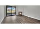 View from balcony overlooking community buildings, with modern fireplace, and wood-style flooring at 950 Seven Hills Dr # 124, Henderson, NV 89052