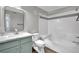 Bright bathroom featuring a modern vanity, tub with shower, and contemporary design elements at 950 Seven Hills Dr # 124, Henderson, NV 89052