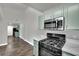 Well-equipped kitchen boasts modern appliances, countertops, and ample cabinet space at 950 Seven Hills Dr # 124, Henderson, NV 89052