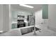 Modern kitchen with stainless appliances, stone countertops, and light-colored cabinetry at 950 Seven Hills Dr # 124, Henderson, NV 89052