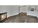 Spacious living room with fireplace, modern flooring, leading into a stylish kitchen at 950 Seven Hills Dr # 124, Henderson, NV 89052