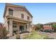 Spacious backyard featuring a covered patio, putting green, outdoor seating areas, and well-maintained landscaping at 9853 Bangalore Ct, Las Vegas, NV 89148