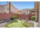 Spacious backyard features a putting green, desert landscaping, and privacy fence at 9853 Bangalore Ct, Las Vegas, NV 89148