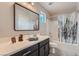 Bathroom featuring stylish vanity, framed mirror, and shower-tub combination at 9853 Bangalore Ct, Las Vegas, NV 89148