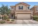 Charming two-story home with landscaped front yard and a two-car garage at 9853 Bangalore Ct, Las Vegas, NV 89148