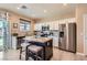 Stylish kitchen with an island, stainless steel appliances, and hardwood floors at 9853 Bangalore Ct, Las Vegas, NV 89148