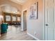 Open-concept living room with hardwood floors and an archway leading to the entryway at 9853 Bangalore Ct, Las Vegas, NV 89148