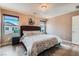 Comfortable main bedroom with ample natural light and a decorative ceiling light fixture at 9853 Bangalore Ct, Las Vegas, NV 89148
