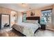 Spacious main bedroom featuring an ensuite bathroom and two bright windows at 9853 Bangalore Ct, Las Vegas, NV 89148