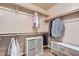 Organized walk-in closet with shelving, drawers, and hanging rods at 9853 Bangalore Ct, Las Vegas, NV 89148