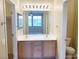 Double sinks offer plenty of space in this naturally lit bathroom at 10190 Deerfield Beach Ave # 202, Las Vegas, NV 89129