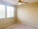 This cozy bedroom is filled with natural light, thanks to the large windows at 10190 Deerfield Beach Ave # 202, Las Vegas, NV 89129
