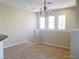 Cozy dining area with ample natural light and a charming chandelier at 10190 Deerfield Beach Ave # 202, Las Vegas, NV 89129