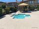 A cozy hot tub provides a relaxing oasis with a shaded seating area nearby at 10190 Deerfield Beach Ave # 202, Las Vegas, NV 89129