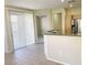 Bright living space featuring tile flooring and sliding glass doors to the backyard at 10190 Deerfield Beach Ave # 202, Las Vegas, NV 89129