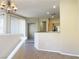 Open-concept living room featuring recessed lighting and a breakfast bar at 10190 Deerfield Beach Ave # 202, Las Vegas, NV 89129
