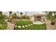 Expansive backyard with artificial grass, paved patio, and landscaped area, perfect for outdoor enjoyment at 10248 Maggira Pl, Las Vegas, NV 89135