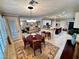 Open-concept dining area with a round table and seating adjacent to the kitchen at 10248 Maggira Pl, Las Vegas, NV 89135