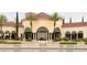Grand building exterior overlooking a water feature, exuding sophistication and elegance at 10248 Maggira Pl, Las Vegas, NV 89135