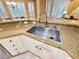 Kitchen featuring a stainless steel sink and granite countertops with white cabinets and modern faucet at 10248 Maggira Pl, Las Vegas, NV 89135