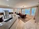 Well-lit kitchen with stainless steel refrigerator and an adjacent dining area at 10248 Maggira Pl, Las Vegas, NV 89135