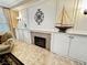 Comfortable living room featuring a cozy fireplace and custom built-in cabinetry at 10248 Maggira Pl, Las Vegas, NV 89135