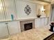 Bright living room featuring a fireplace, custom cabinets, and decorative accents at 10248 Maggira Pl, Las Vegas, NV 89135