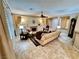 Comfortable living room with a fireplace, tile flooring, and natural light, ideal for relaxation at 10248 Maggira Pl, Las Vegas, NV 89135