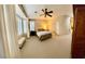 The main bedroom includes neutral carpet, a ceiling fan, white shutters, and convenient access to a full en-suite bathroom at 10248 Maggira Pl, Las Vegas, NV 89135